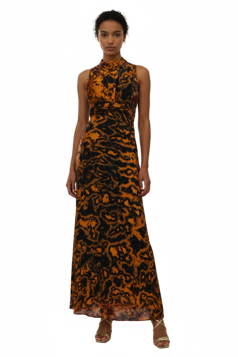 Woman wearing a long, patterned dress on a white background-Sanjules