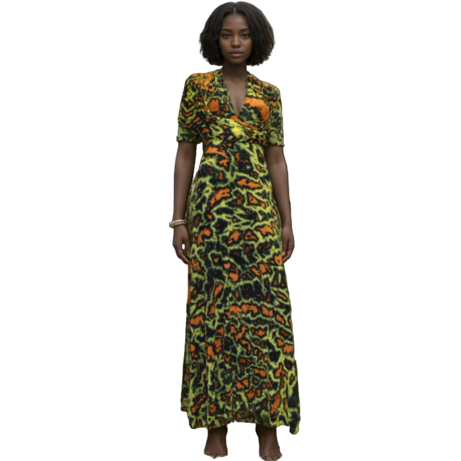 Woman wearing a green and orange patterned dress on a white background-Sanjules