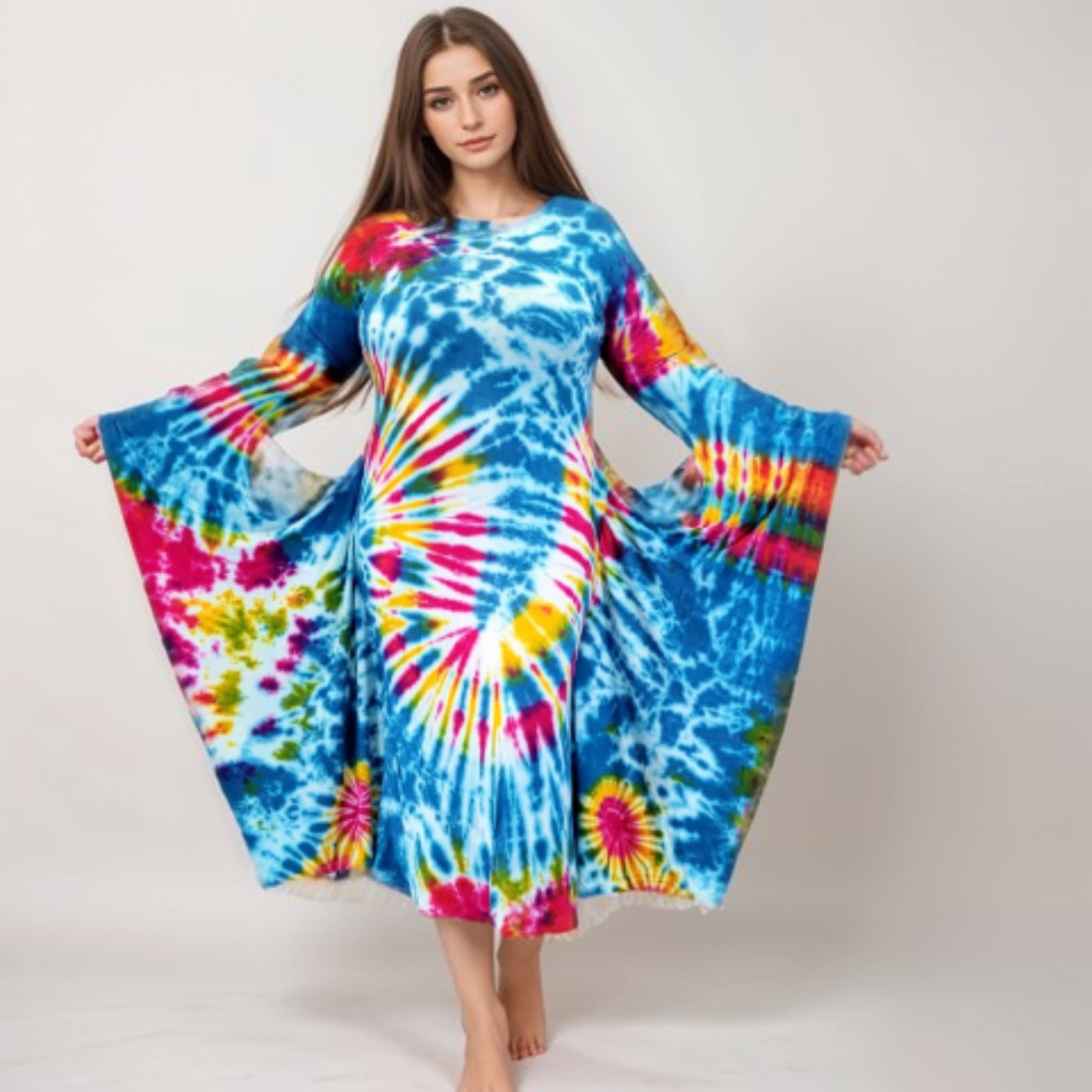 Woman wearing a colorful tie-dye dress on a white background-Sanjules
