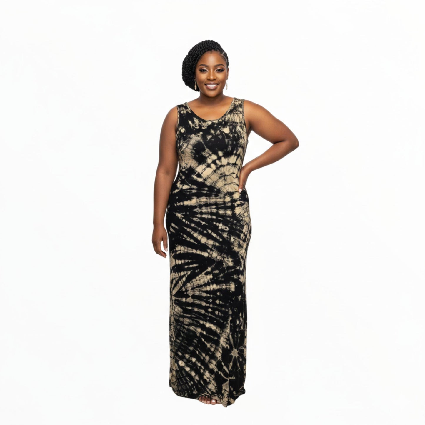 Woman wearing a black and beige tie-dye dress on a white background. SanJules