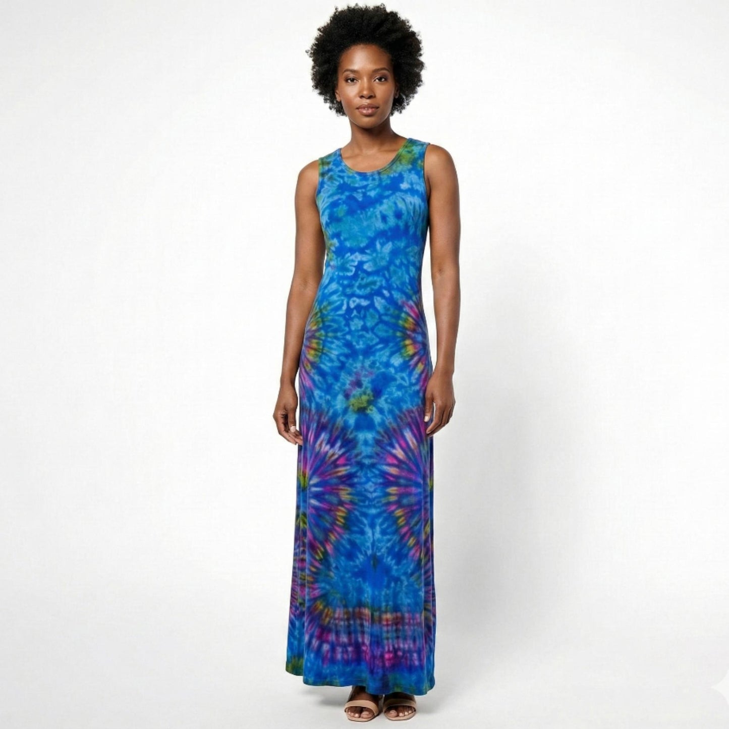 Woman wearing a blue tie-dye dress on a white background. SanJules