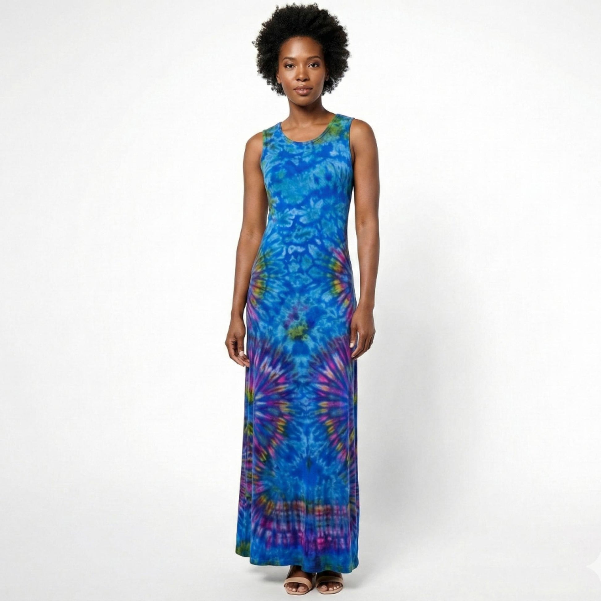 Woman wearing a blue tie-dye dress on a white background. SanJules