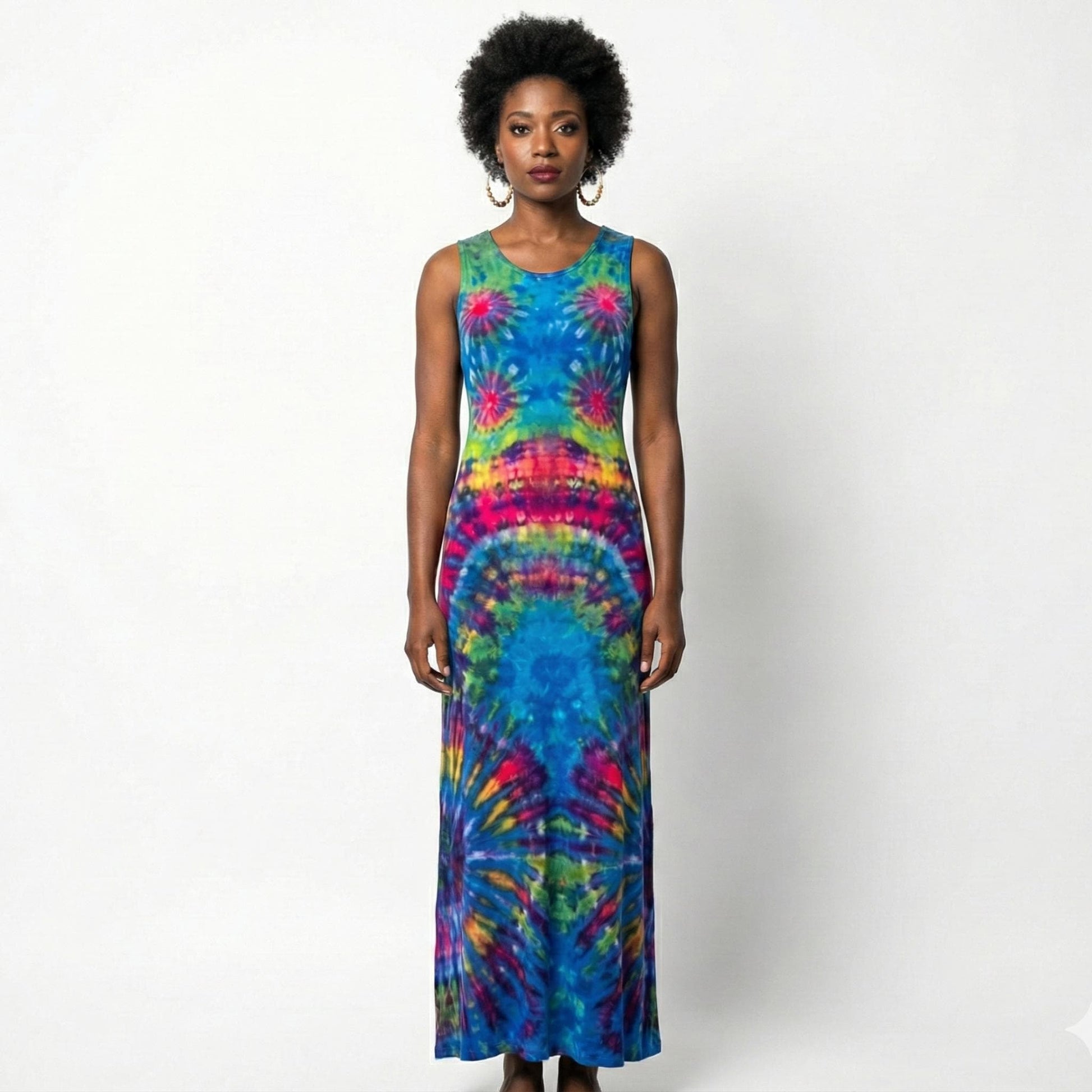 Woman wearing a tie-dye dress on a white background. SanJules
