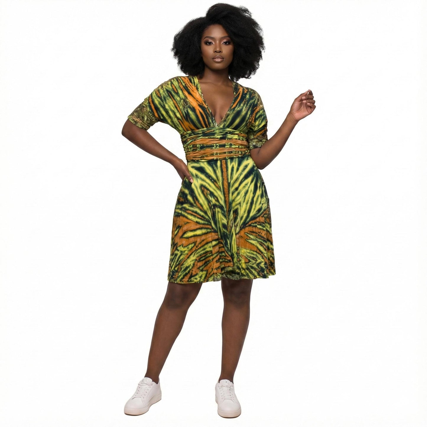 Woman wearing a green and orange patterned dress on a white  background SanJules 