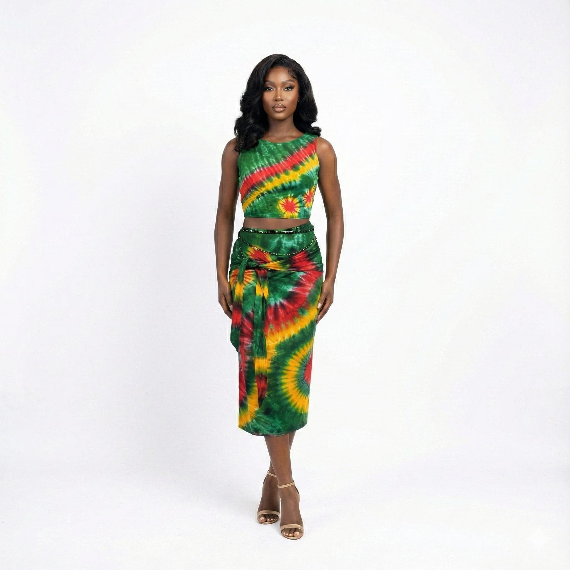 Woman wearing a green, red, and yellow tie-dye outfit on a white background SanJules