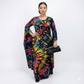 Woman wearing a colorful tie-dye dress on a white background