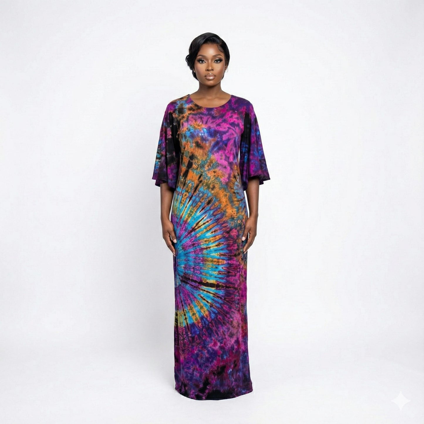 Woman wearing a tie-dye dress on a white background