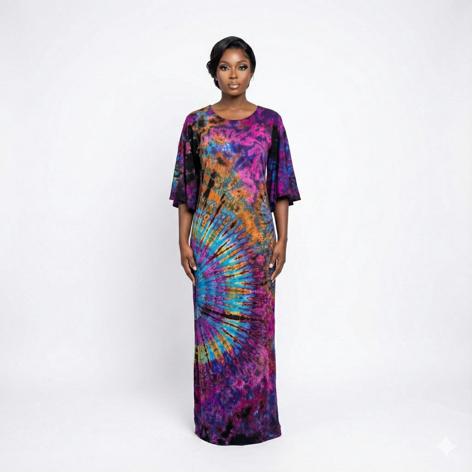 Woman wearing a tie-dye dress on a white background