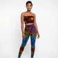 Woman wearing a colorful tie-dye tube top on a white background