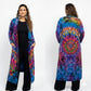 Person wearing a colorful tie-dye long cardigan on a white background-sanjules