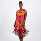 Woman wearing a colorful tie-dye dress with strips on a white background