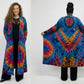 Person wearing a colorful tie-dye duster on a white background-Sanjules