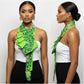 Woman wearing a green patterned necktie around her neck against a white background