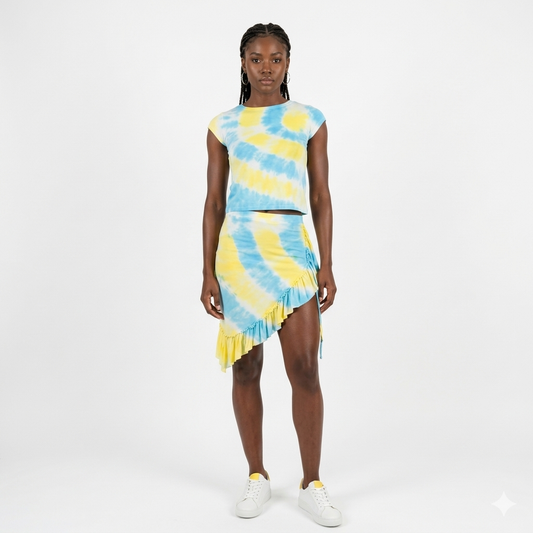 Model wearing a blue and yellow tie-dye outfit on a white background