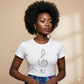 Woman wearing a white t-shirt with a decorative clef symbol on a beige background