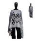 Gray and black patterned poncho on a mannequin against a white background