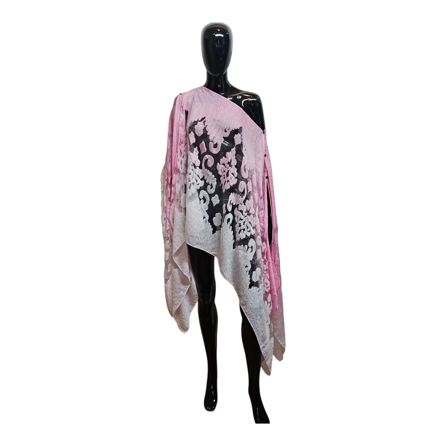 Mannequin wearing a pink and white floral patterned scarf on a white background