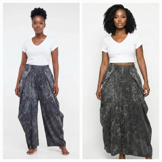 Woman wearing a white top and gray patterned pants on a white background