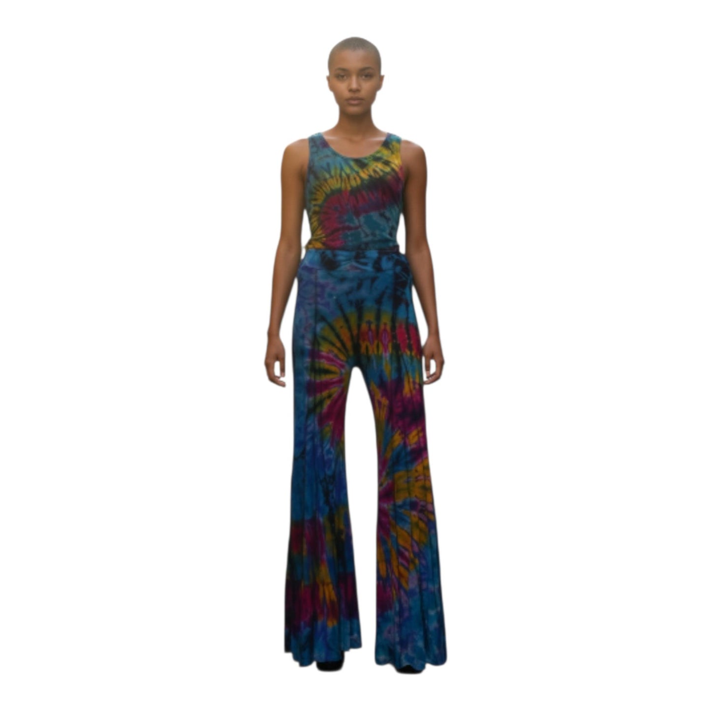 Model wearing a tie-dye top and pants on a white background