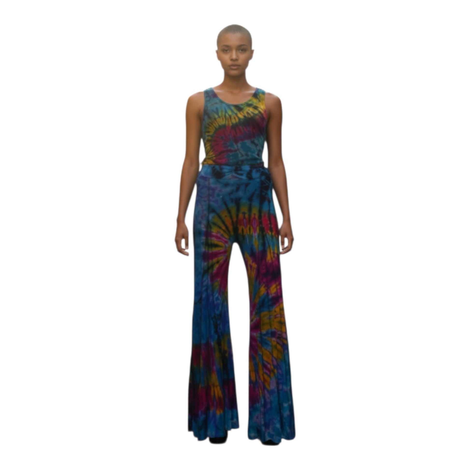 Model wearing a tie-dye top and pants on a white background