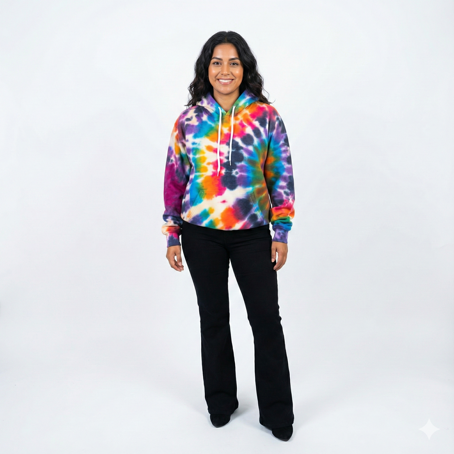 Person wearing a tie-dye hoodie on a white background