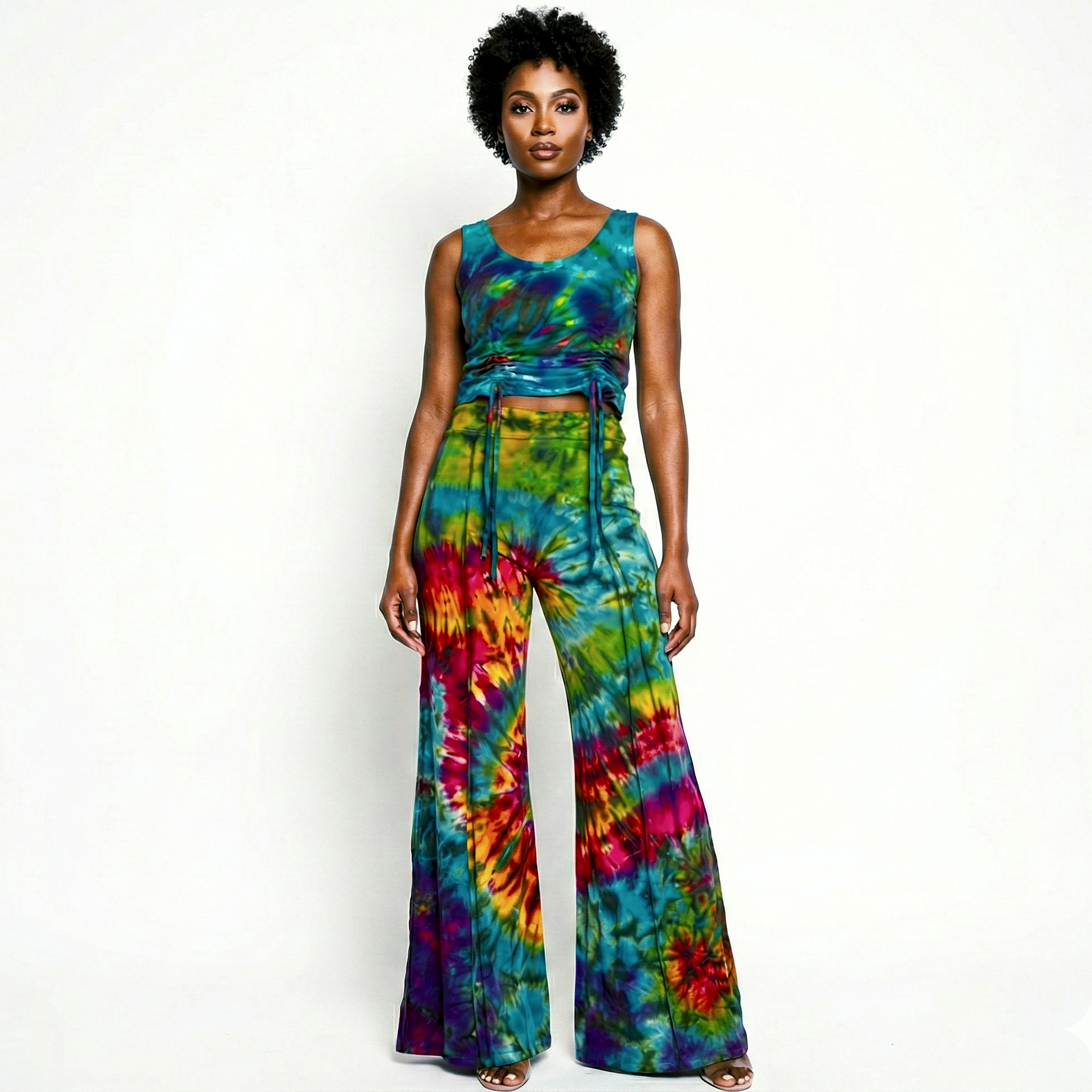 Woman wearing a tie-dye outfit on a white background