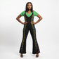 A woman modeling a black flared jumpsuit with vertical multicolor striped accents down the sides