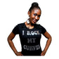 Woman in a black "I Rock My Curves" rhinestone t-shirt, smiling.