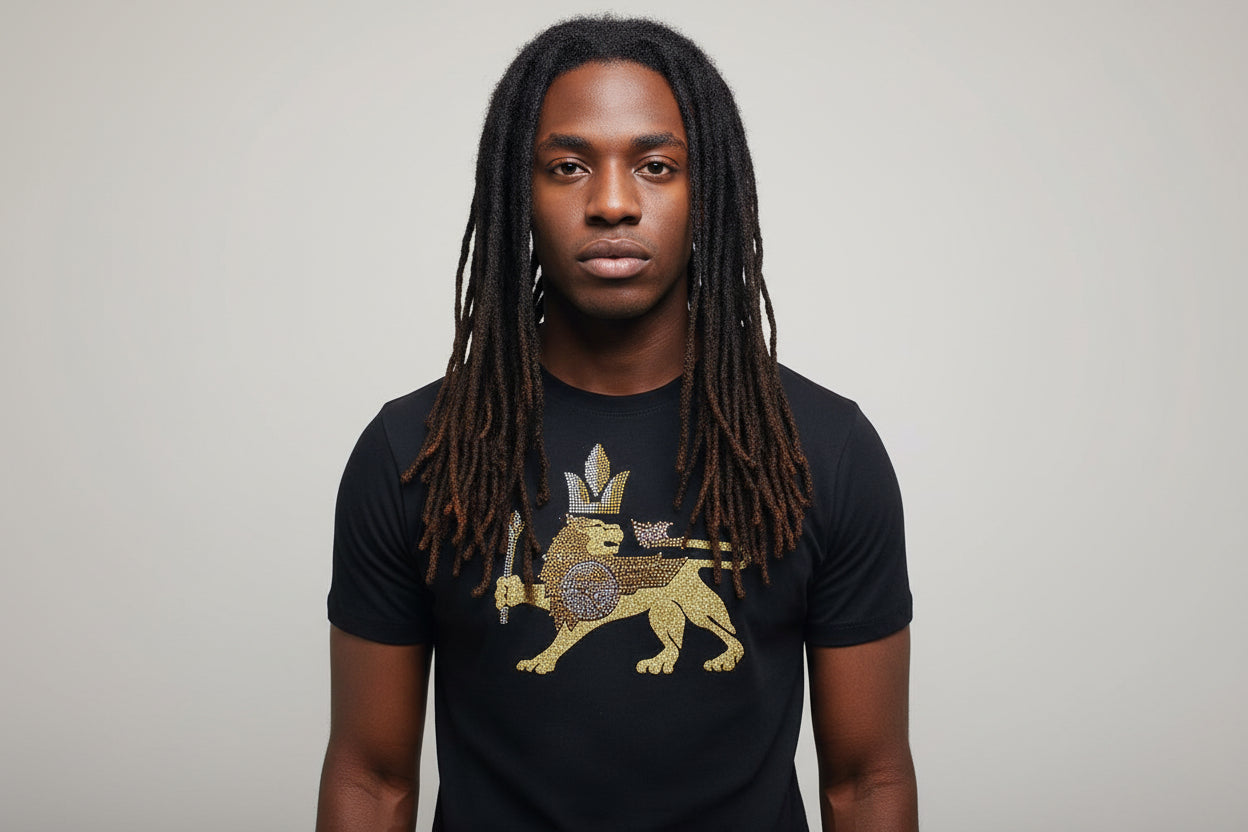 Black 100% cotton t-shirt with a gold and silver film and rhinestone lion wearing a crown graphic.