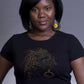 Woman in black Loc Dreams rhinestone natural hair t-shirt with gold and black loc design.