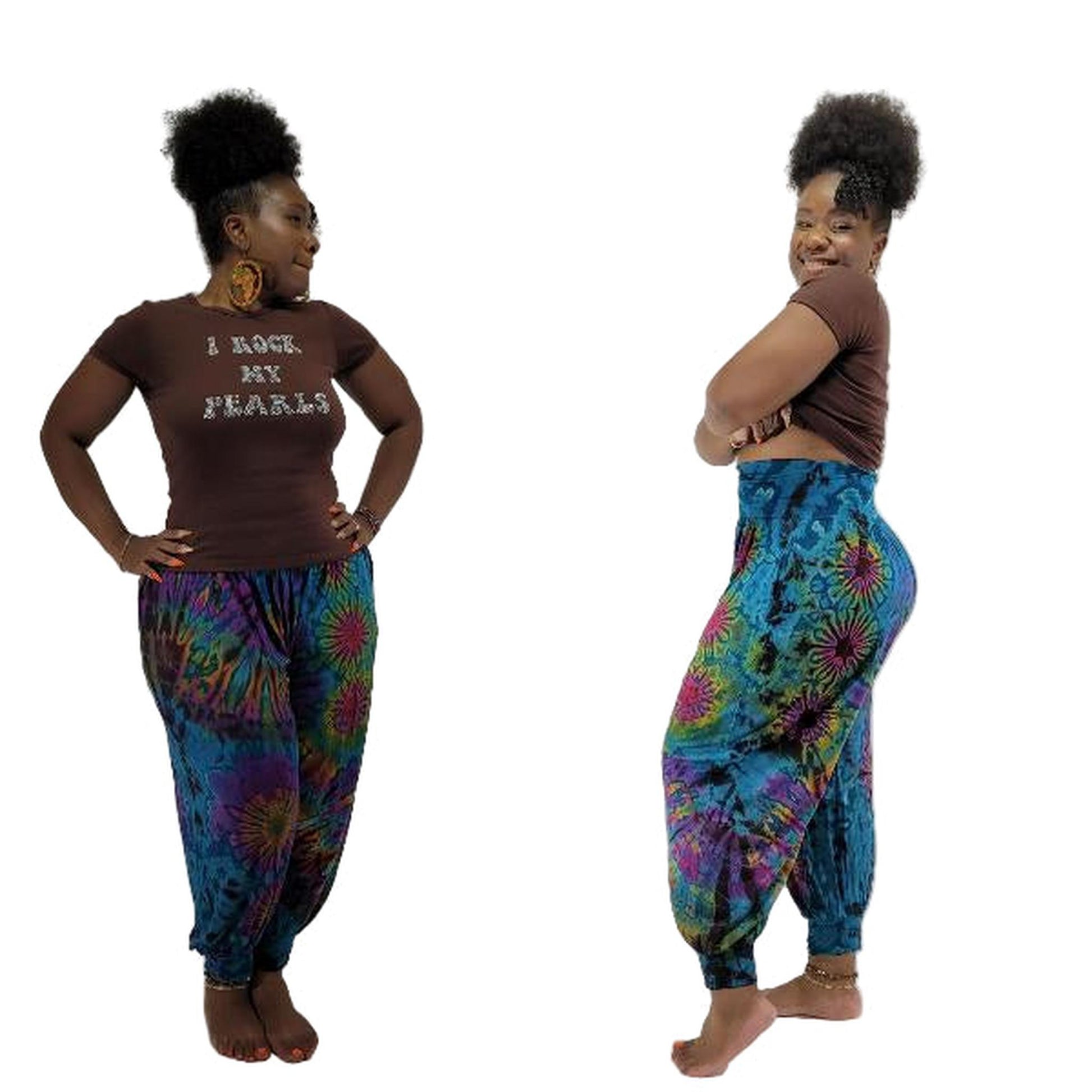 Woman wearing a brown t-shirt with text and colorful tie-dye pants on a white background
